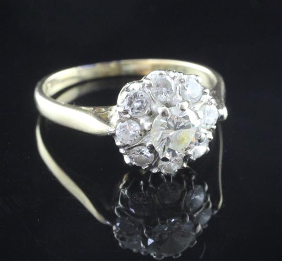 A 1970s 18ct gold diamond cluster ring, size M.